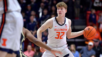 Mar 7, 2025; Champaign, Illinois, USA;  Illinois Fighting Illini guard Kasparas Jakucionis (32) looks to pass during the first half against the Purdue Boilermakers at State Farm Center. Mandatory Credit: Ron Johnson-Imagn Images