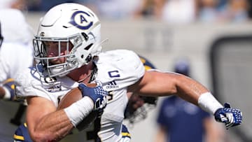 Aug 31, 2024; Berkeley, California, USA; UC Davis Aggies running back Lan Larison (3) carries the ball against the California Golden Bears during the second quarter at California Memorial Stadium. Mandatory Credit: Darren Yamashita-Imagn Images