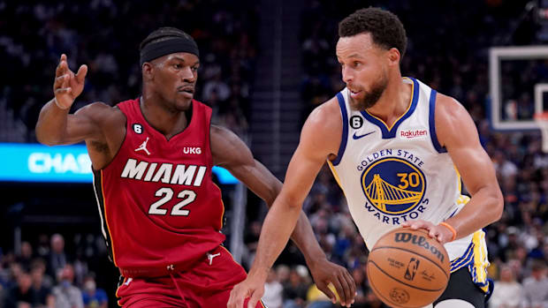 Heat forward Jimmy Butler and Warriors guard Stephen Curry