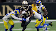 Dec 1, 2024; New Orleans, Louisiana, USA; New Orleans Saints running back Alvin Kamara (41) runs against the Los Angeles Rams during the first half at Caesars Superdome. Mandatory Credit: Matthew Hinton-Imagn Images