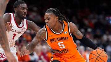 Oklahoma Sooners forward Mohamed Wague (5) tries to get past Oklahoma Sooners guard Kobe Elvis (1) during a men's college Bedlam basketball game between the University of Oklahoma Sooners (OU) and the Oklahoma State University Cowboys (OSU) at Paycom Center in Oklahoma City, Saturday, Dec. 14, 2024. Oklahoma won 80-65.
