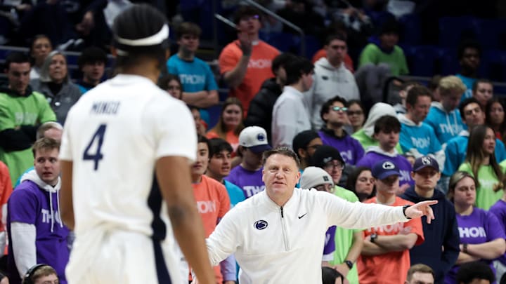 Penn State Nittany Lions head coach Mike Rhoades gestures towards guard Kayden Mingo (4)