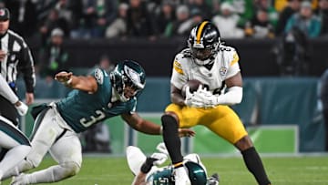 Dec 15, 2024; Philadelphia, Pennsylvania, USA; Pittsburgh Steelers running back Cordarrelle Patterson (84) is tackled by Philadelphia Eagles linebacker Zack Baun (53) and  linebacker Nolan Smith Jr. (3) during the third quarter at Lincoln Financial Field. Mandatory Credit: Eric Hartline-Imagn Images
