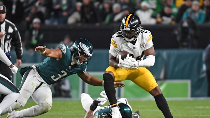 Dec 15, 2024; Philadelphia, Pennsylvania, USA; Pittsburgh Steelers running back Cordarrelle Patterson (84) is tackled by Philadelphia Eagles linebacker Zack Baun (53) and  linebacker Nolan Smith Jr. (3) during the third quarter at Lincoln Financial Field. Mandatory Credit: Eric Hartline-Imagn Images