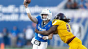 Memphis' Seth Henigan (2) throws the ball as Bethune-Cookman   s Eddie Walls III (9) tries to tackle him during the game between the University of Memphis and Bethune-Cookman University in Memphis, Tenn., on Saturday, September 2, 2023.