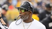 Nov 8, 2025; Morgantown, West Virginia, USA; Colorado Buffaloes head coach Deion Sanders walks along the sidelines late in the fourth quarter against the West Virginia Mountaineers at Milan Puskar Stadium. Mandatory Credit: Ben Queen-Imagn Images