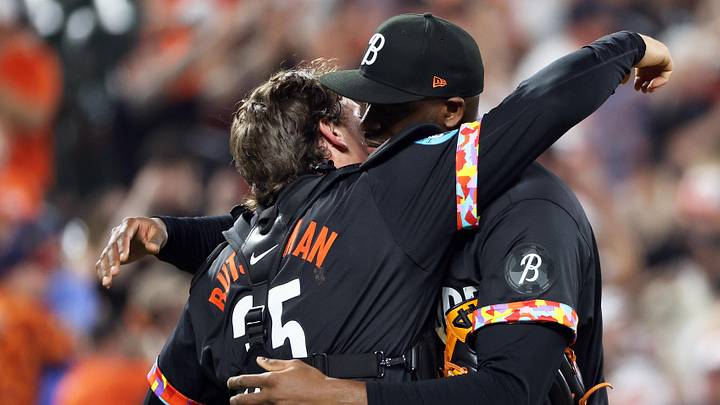 May 2, 2025; Baltimore, Maryland, USA; Baltimore Orioles pitcher Felix Bautista (74) and Baltimore Orioles catcher Adley Rutschman (35) hug after a game against the Kansas City Royals at Oriole Park at Camden Yards. Mandatory Credit: Daniel Kucin Jr.-Imagn Images