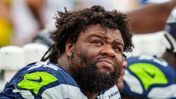 Quinton Bohanna with the Seattle Seahawks watches the scoreboard