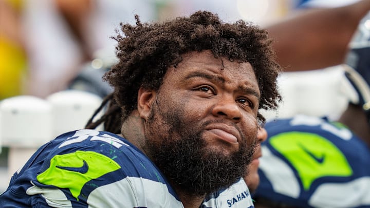 Quinton Bohanna with the Seattle Seahawks watches the scoreboard