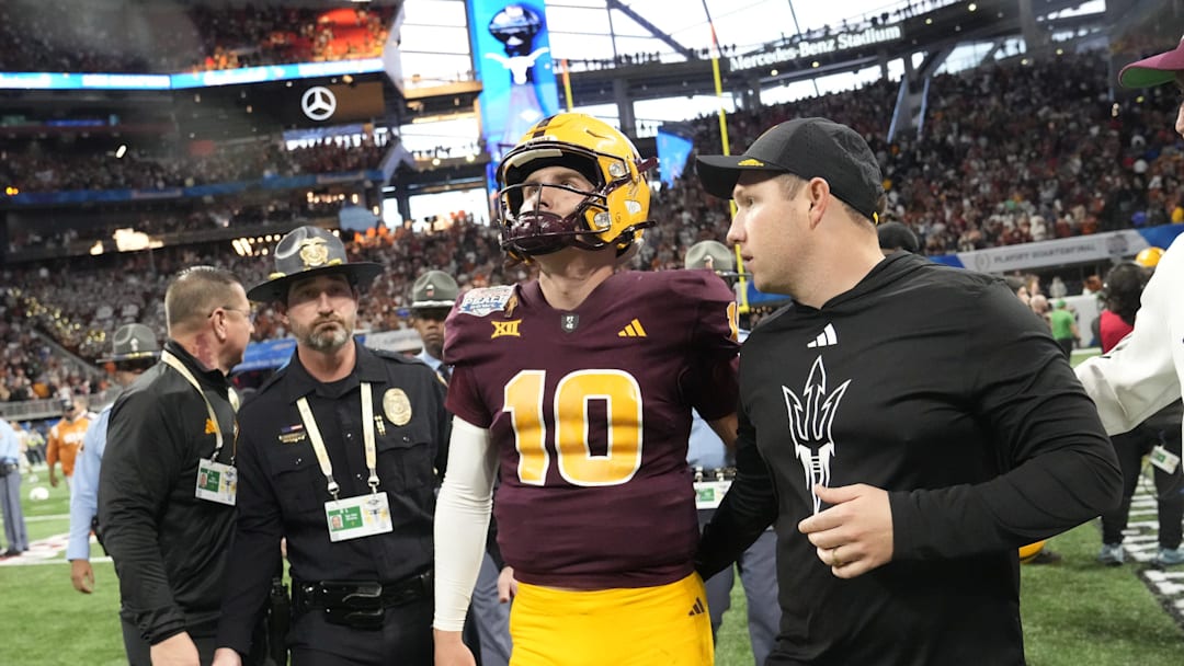 Arizona State quarterback Sam Leavitt (10) and Arizona State head coach Kenny Dillingham walk off the field after Texas won 39-31 in double overtime in the Chick-fil-A Peach Bowl in Atlanta on Jan. 1, 2025.