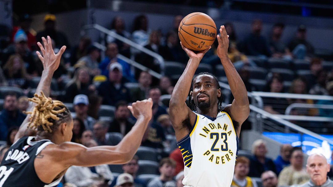Nov 5, 2025; Indianapolis, Indiana, USA; Indiana Pacers guard/forward Aaron Nesmith (23) shoots the ball while Brooklyn Nets forward/center Noah Clowney (21) defends in the first half at Gainbridge Fieldhouse. Mandatory Credit: Trevor Ruszkowski-Imagn Images Nov 5, 2025; Indianapolis, Indiana, USA; Indiana Pacers guard/forward Aaron Nesmith (23) shoots the ball while Brooklyn Nets forward/center Noah Clowney (21) defends in the first half at Gainbridge Fieldhouse. Mandatory Credit: Trevor Ruszkowski-Imagn Images