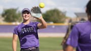 Queen Creek High softball player Emma Reynolds warms up during practice.