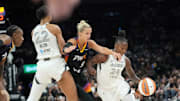 Phoenix Mercury guard Kitija Laksa (9) fights over a screen by Las Vegas Aces center A'ja Wilson (22) while defending guard Jewell Loyd (24) during the first quarter at PHX Arena Jun 29, 2025.