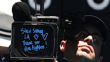 Camera crew displays encouraging message