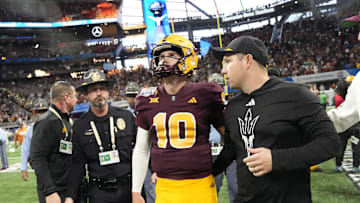 Arizona State quarterback Sam Leavitt (10) and Arizona State head coach Kenny Dillingham walk off the field after Texas won 39-31 in double overtime in the Chick-fil-A Peach Bowl in Atlanta on Jan. 1, 2025.