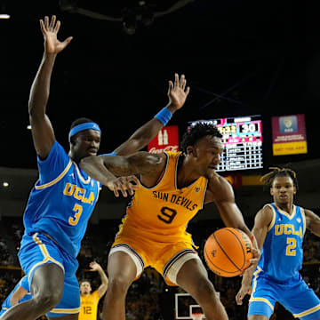 Arizona State Sun Devils center Shawn Phillips Jr. (9) backs down UCLA Bruins forward Adem Bona (3) during the second half at Desert Financial Arena in Tempe on Jan. 17, 2024.