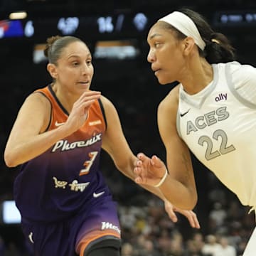 Phoenix Mercury guard Diana Taurasi defends against Las Vegas Aces center A'ja Wilson