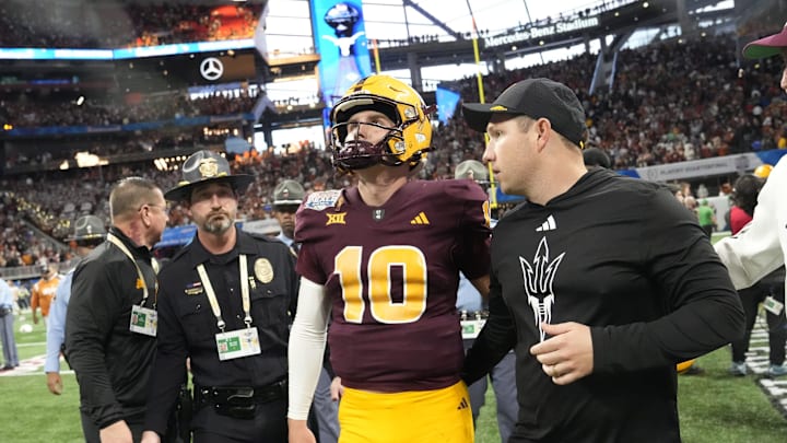 Arizona State quarterback Sam Leavitt (10) and Arizona State head coach Kenny Dillingham walk off the field after Texas won 39-31 in double overtime in the Chick-fil-A Peach Bowl in Atlanta on Jan. 1, 2025.
