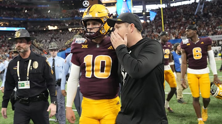 Arizona State head coach Kenny Dillingham whispers to quarterback Sam Leavitt (10) after Texas won 39-31 over Arizona State in double overtime in the Chick-fil-A Peach Bowl in Atlanta on Jan. 1, 2025. Arizona State head coach Kenny Dillingham whispers to quarterback Sam Leavitt (10) after Texas won 39-31 over Arizona State in double overtime in the Chick-fil-A Peach Bowl in Atlanta on Jan. 1, 2025.
