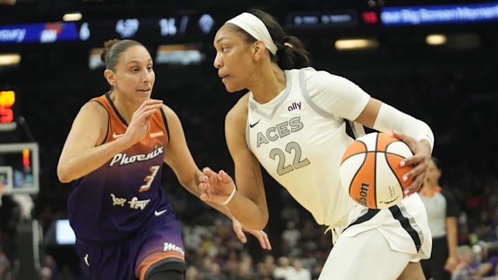 Phoenix Mercury guard Diana Taurasi defends against Las Vegas Aces center A'ja Wilson