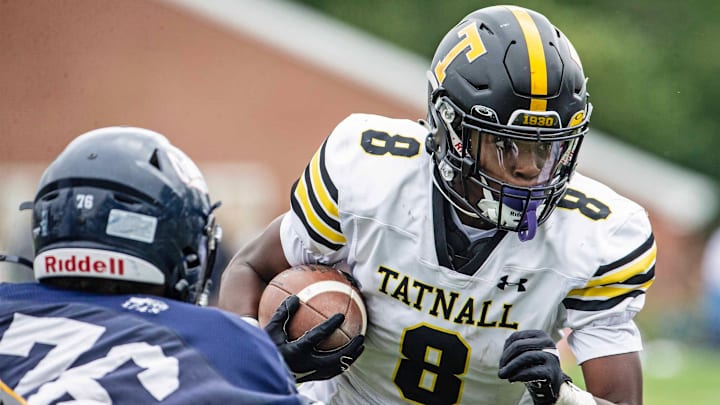 Tatnall senior RJ Moore (8) picks up yards as Wilmington Friends junior Joseph Coppola (76) bears down during the football game at the Wilmington Friends football stadium in Alapocas, Saturday, Sept. 7, 2024. Tatnall won 22-17.