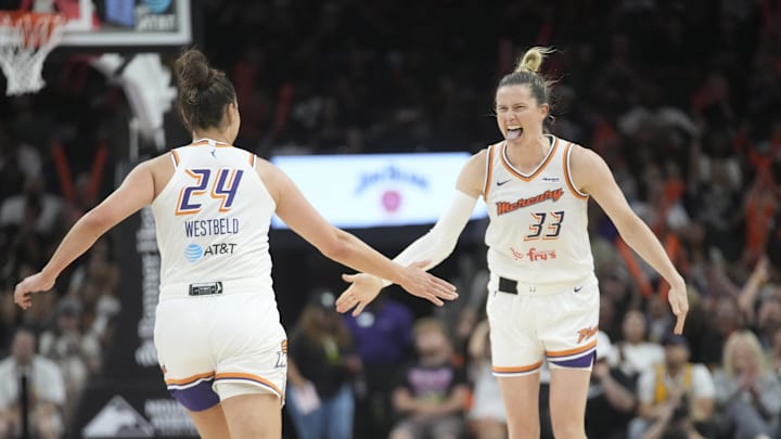 Phoenix Mercury guard Sami Whitcomb (33) celebrates a three-point basket with forward Kathryn Westbeld (24) against the Dallas Wings during the third quarter at PHX Arena on July 7, 2025.