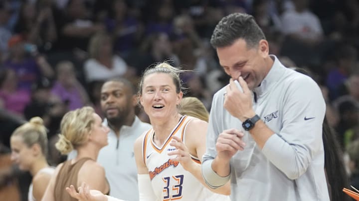 Phoenix Mercury guard Sami Whitcomb (33) laughs with head coach Nate Tibbetts during the fourth quarter against the Dallas Wings at PHX Arena on July 7, 2025.