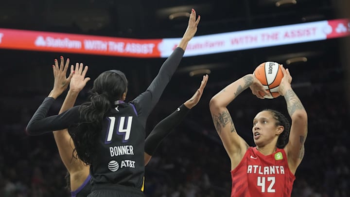 Atlanta Dream center Brittney Griner (42) is defended by Phoenix Mercury forward DeWanna Bonner (14) during the first quarter at PHX Arena Jul 23, 2025. Atlanta Dream center Brittney Griner (42) is defended by Phoenix Mercury forward DeWanna Bonner (14) during the first quarter at PHX Arena Jul 23, 2025.