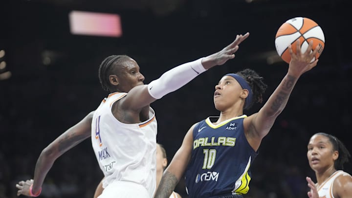 Dallas Wings guard Aziaha James (10) is defended by Phoenix Mercury forward Natasha Mack (4) during the first quarter at PHX Arena on July 7, 2025.