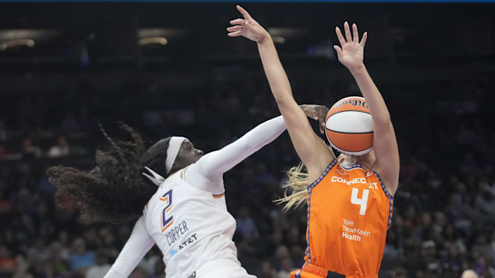 Phoenix Mercury guard Kahleah Copper (2) defends against Connecticut Sun guard Jacy Sheldon (4) during the fourth quarter at PHX Arena Aug 5, 2025.