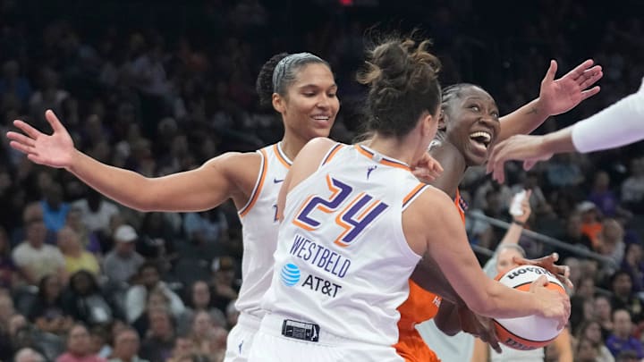 Phoenix Mercury forwards Alyssa Thomas (25) and Kathryn Westbeld (24) defend against Connecticut Sun center Tina Charles (31) during the third quarter in Phoenix, at PHX Arena on Aug 5, 2025.