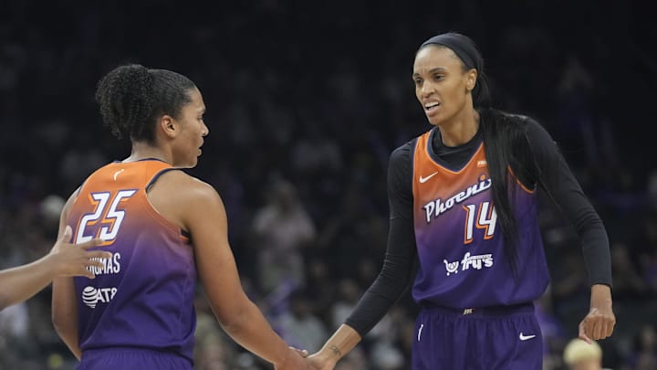Phoenix Mercury forward Alyssa Thomas (25) slaps hands with Phoenix Mercury forward DeWanna Bonner (14) during the first quarter against the Minnesota Lynx at PHX Arena on July 9, 2025. Phoenix Mercury forward Alyssa Thomas (25) slaps hands with Phoenix Mercury forward DeWanna Bonner (14) during the first quarter against the Minnesota Lynx at PHX Arena on July 9, 2025.