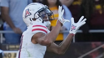 Arizona wide receiver Tetairoa McMillan (4) catches a touchdown pass against Arizona State during the third quarter at Mountain America Stadium in Tempe on Nov. 25, 2023.