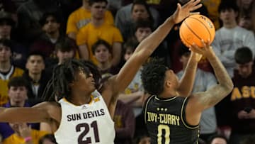UCF guard Jordan Ivy-Curry (0) has his shot blocked by Arizona State forward Jayden Quaintance (21) during Big 12 play at Desert Financial Arena in Tempe.