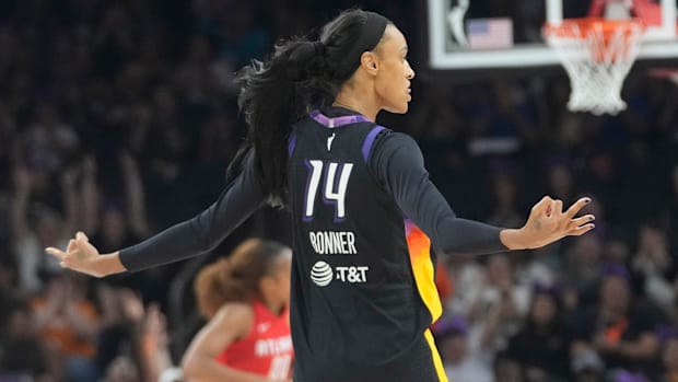 DeWanna Bonner celebrating hitting a three