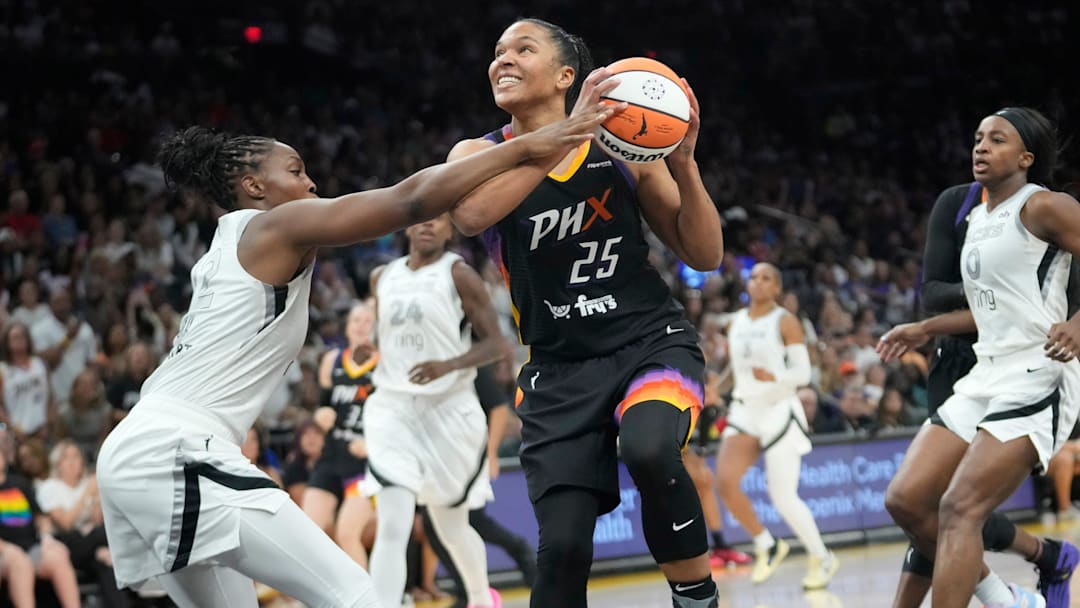 Phoenix Mercury forward Alyssa Thomas (25) is fouled by Las Vegas Aces guard Chelsea Gray (12) during the fourth quarter at PHX Arena Jun 29, 2025.