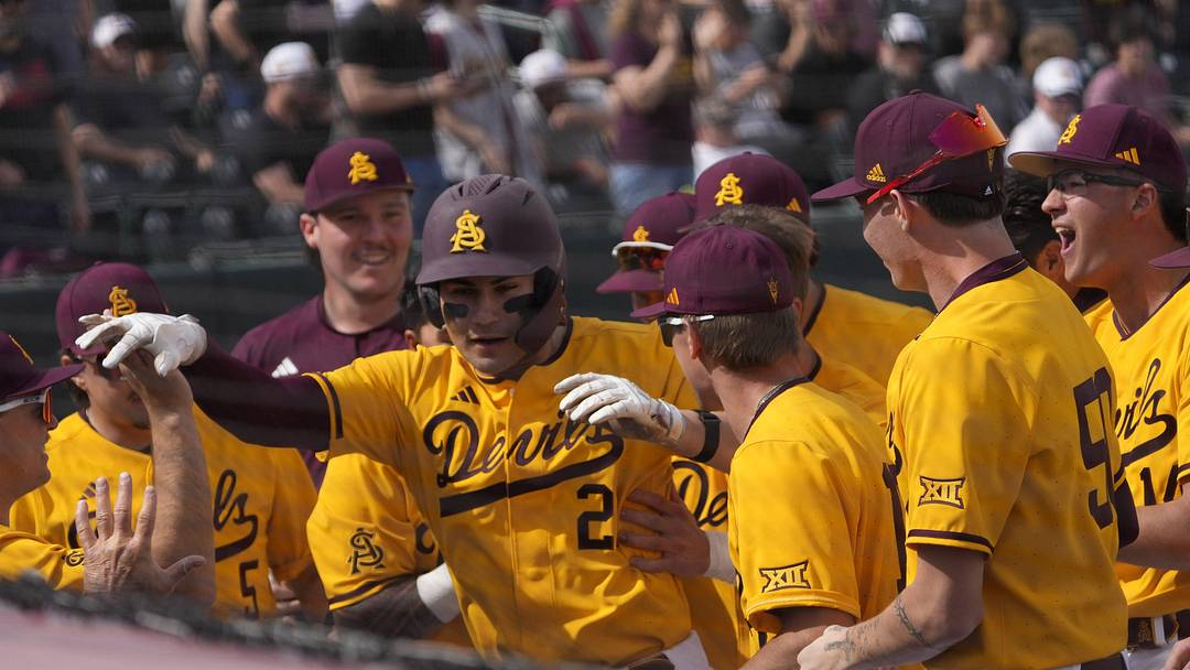 Arizona State catcher Josiah Cromwick (21) is congratulated after a solo home run against Ohio State during the first inning at Phoenix Municipal Stadium on Feb. 16, 2025.
