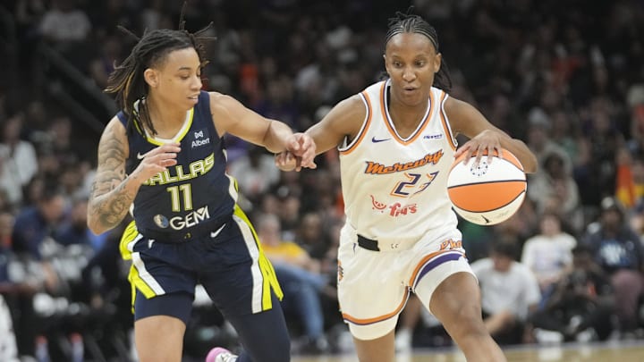 Phoenix Mercury guard Kiana Williams (23) is defended by Dallas Wings guard JJ Quinerly (11) during the third quarter at PHX Arena on July 7, 2025.