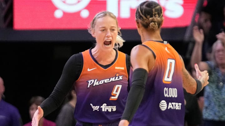 Phoenix Mercury guard Sophie Cunningham (9) celebrates with guard Natasha Cloud.