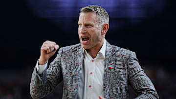Alabama head coach Nate Oats celebrates a play against Connecticut during the Final Four semifinal game at State Farm Stadium.