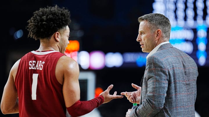 Alabama guard Mark Sears (1) talks with head coach Nate Oats during the Final Four semifinal game against Connecticut at State Farm Stadium.