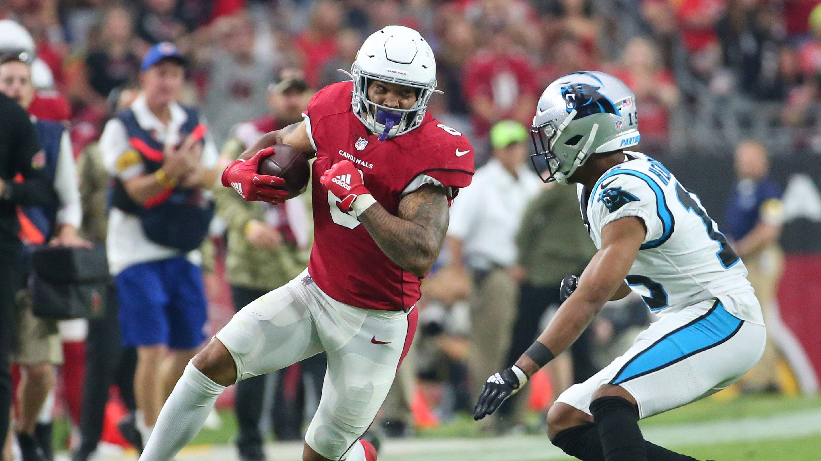 Nov 14, 2021; Glendale, AZ, USA; Arizona Cardinals running back James Conner (6) runs against Carolina Panthers cornerback C.J. Henderson (15) during the third quarter at State Farm Stadium. Mandatory Credit: Michael Chow-Arizona Republic Nfl Cardinals Vs Panthers Carolina Panthers At Arizona Cardinals