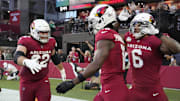 Arizona Cardinals wide receiver Marvin Harrison Jr. (18) celebrates his touchdown catch with center Evan Brown (62) and running back James Conner (6) against the New York Jets during the second quarter at State Farm Stadium in Glendale on Nov. 10, 2024.