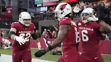 Arizona Cardinals wide receiver Marvin Harrison Jr. (18) celebrates his touchdown catch with center Evan Brown (62) and running back James Conner (6) against the New York Jets during the second quarter at State Farm Stadium in Glendale on Nov. 10, 2024.
