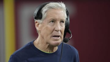 Ex-Seahawks head coach Pete Carroll looks at the scoreboard in Arizona in 2024.