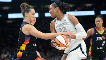 Phoenix Mercury guard Kahleah Copper (2) knocks the ball away from Las Vegas Aces center A'ja Wilson (22) during the first quarter at PHX Arena Jun 29, 2025.