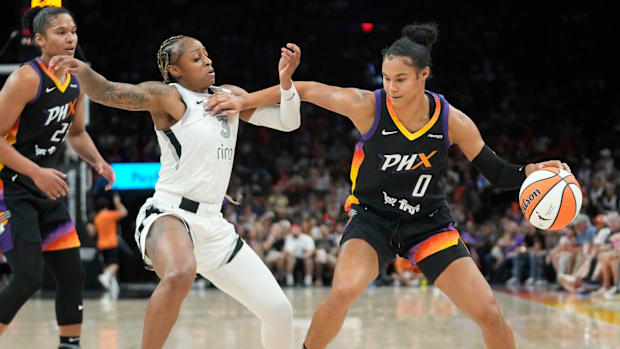 A photo of Satou Sabally protecting the ball