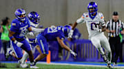 Boise State's Ty Benefield runs the ball back on an interception.