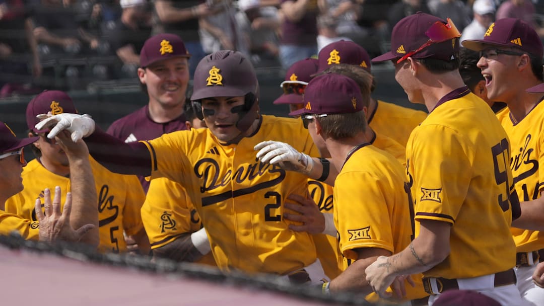 Arizona State catcher Josiah Cromwick (21) is congratulated after a solo home run against Ohio State during the first inning at Phoenix Municipal Stadium on Feb. 16, 2025.