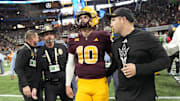Arizona State quarterback Sam Leavitt (10) and Arizona State head coach Kenny Dillingham walk off the field after Texas won 39-31 in double overtime in the Chick-fil-A Peach Bowl in Atlanta on Jan. 1, 2025.